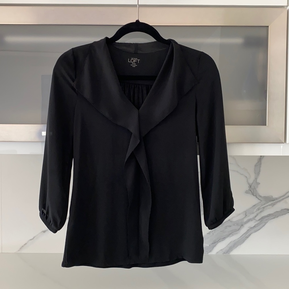 BL blouse with ruffle detail around neck and front